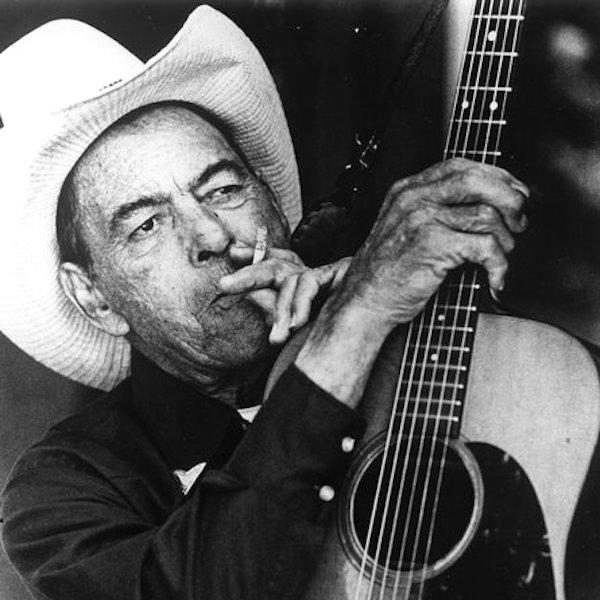 A man holding a guitar.