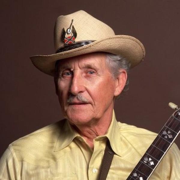 A man holding a guitar.