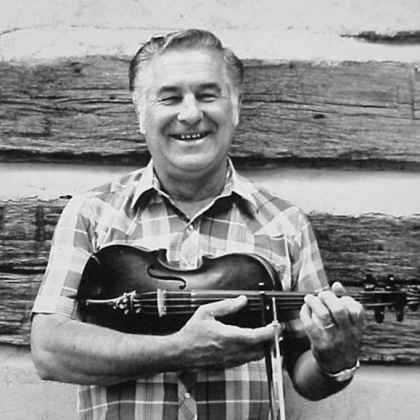 Man holding a fiddle.