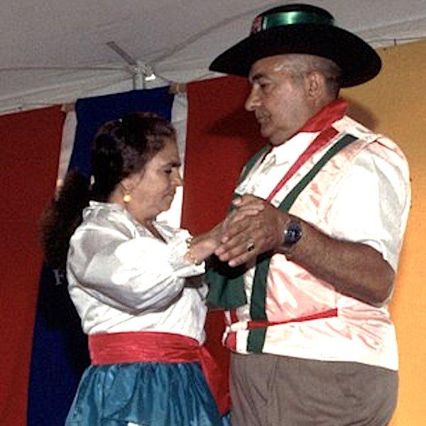 A man and a woman dancing toghether.