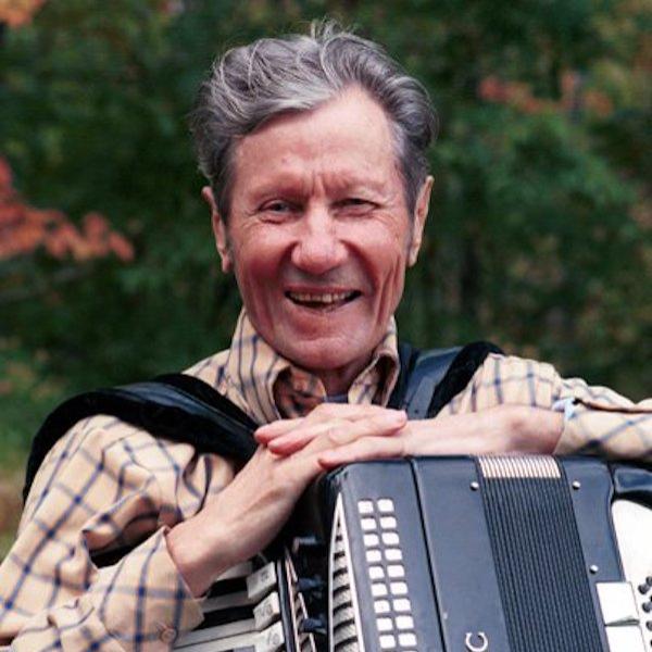 A man holding an accordion.