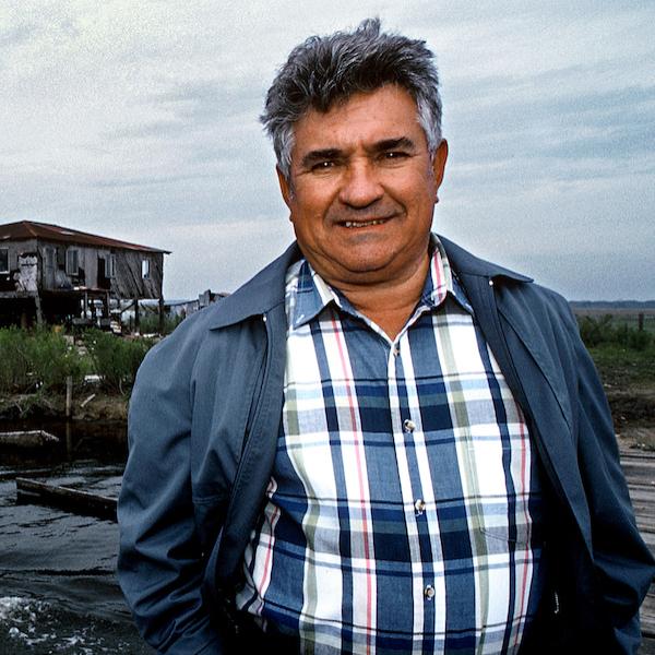 A man standing near a dock.