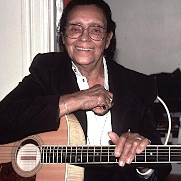 A man holding a guitar