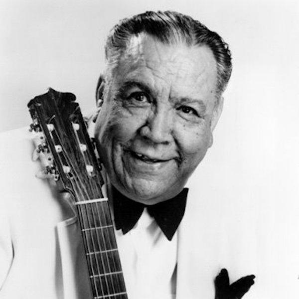 A man holdinga guitar.
