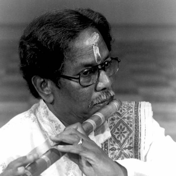 Man playing the flute.