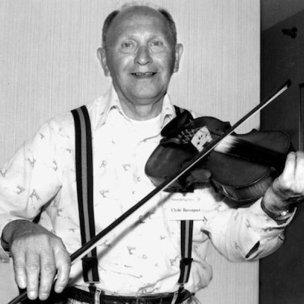 A man playing a fiddle.