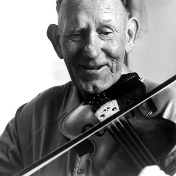 A man playing the fiddle.