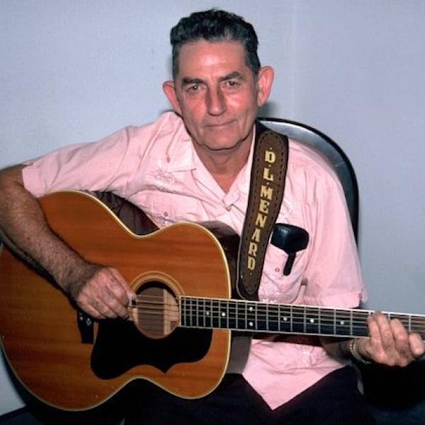 A man playing a guitar.