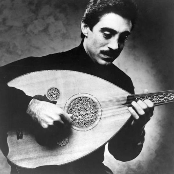 A man playing a laud.