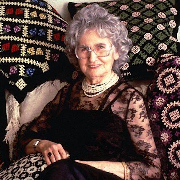 A woman sitting on a couch.