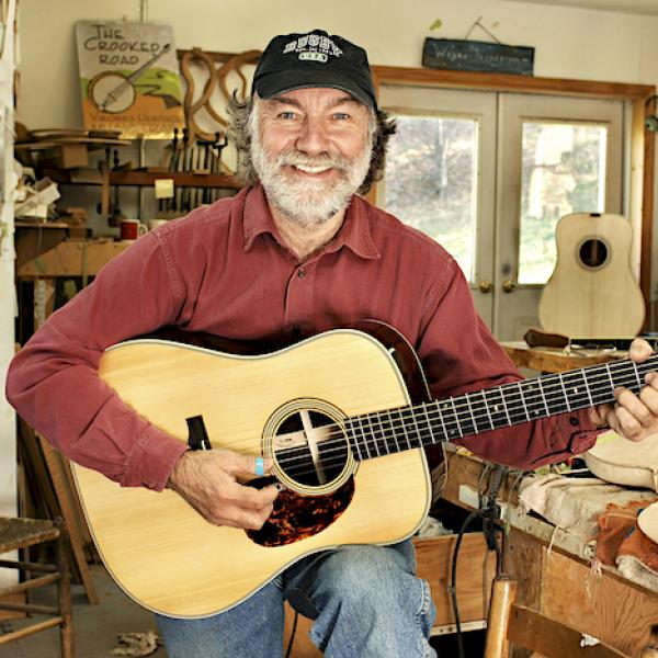 A man playing a guitar.
