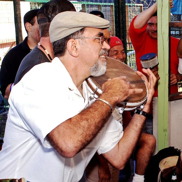 A man playing a pandereta.