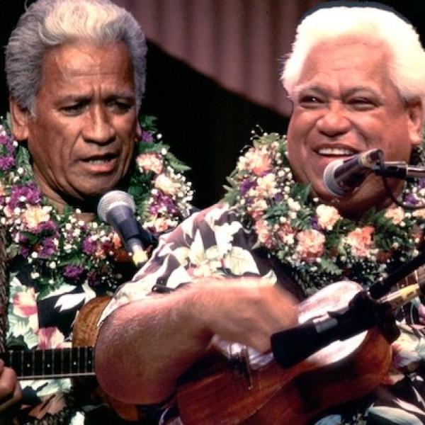 Two men on a stage paling instruments.