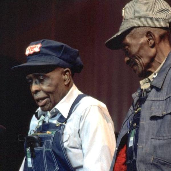 Two men on a stage.