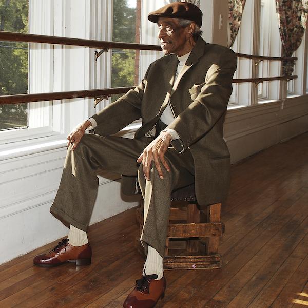 A man sitting by a window.