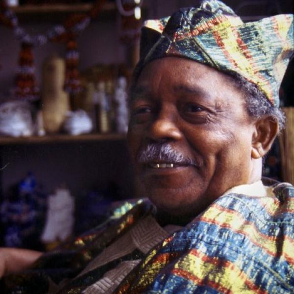 A man wearing traditional african hat.