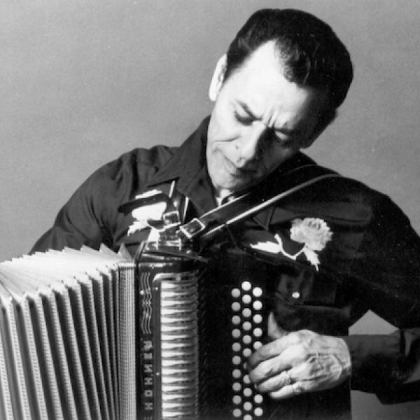 A man playing an accordion.