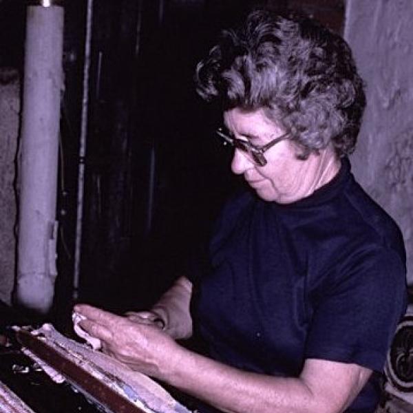 a woman weaving.
