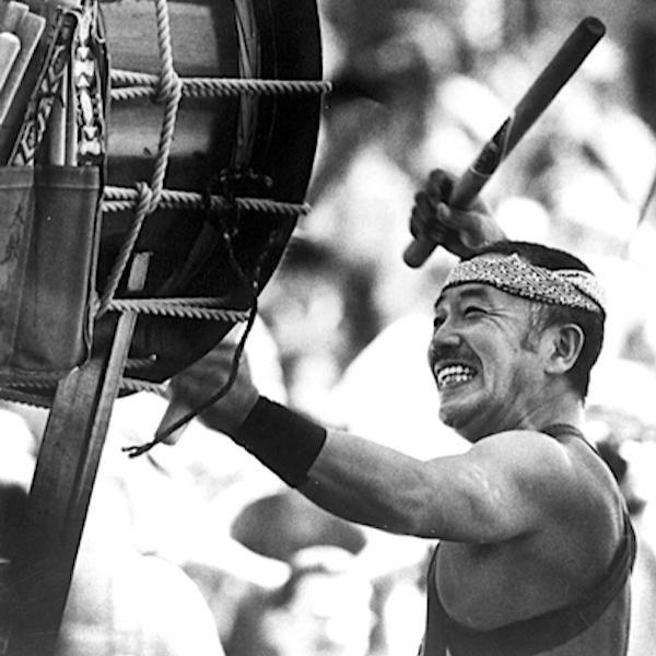 A man playing a big drum.