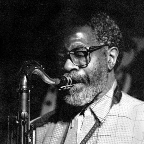 man playing saxophone.