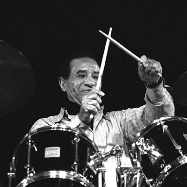 Man playing drums. 
