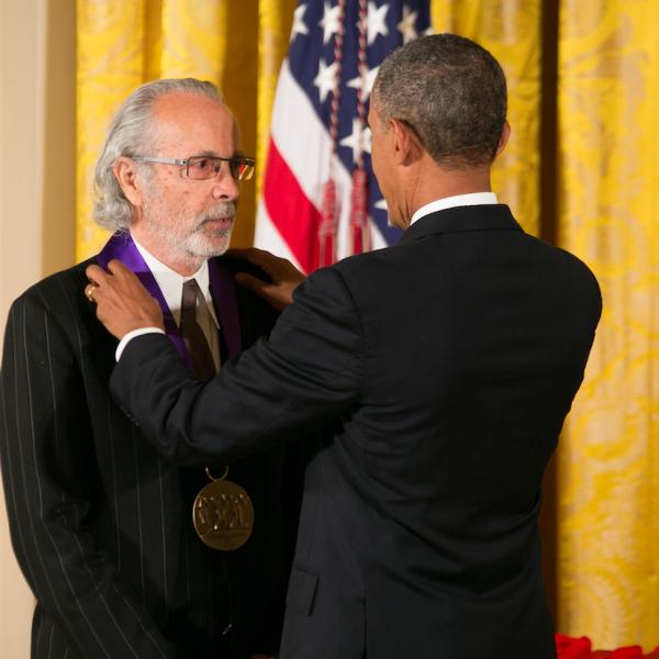 Alpert receiving medal.