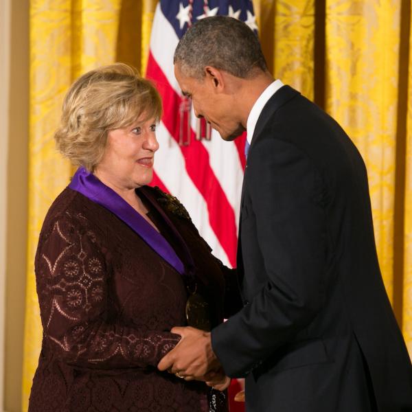 Arison receiving her medal.