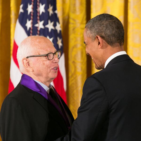 Kelly receiving his medal form President Obama.