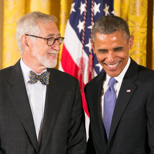 Olin receiving his medal form President Obama.