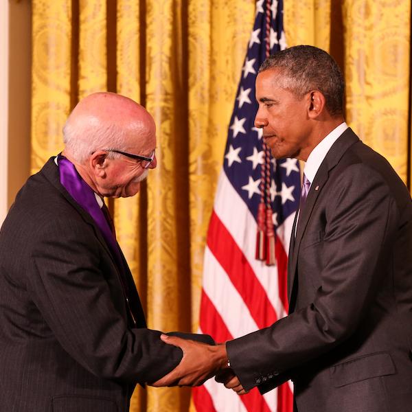 Mr. Wolff receives his medal from President Obama.