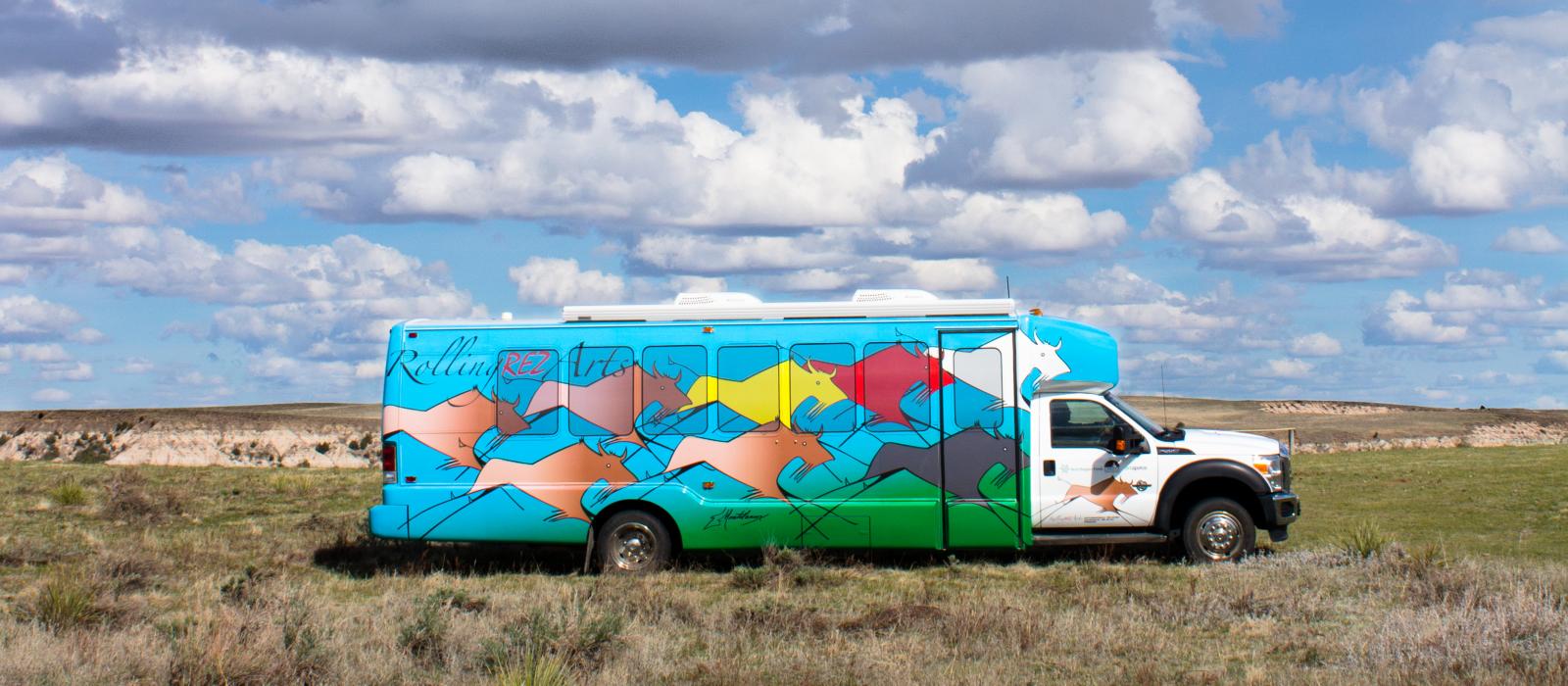 Colorfully decorated bus in the middle of the plains.
