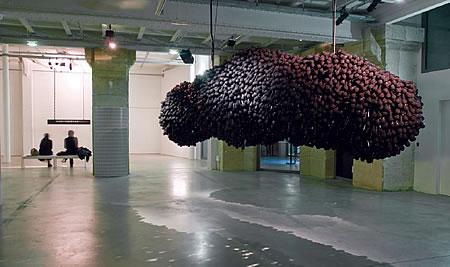 Thousands of microphones in the shape of a cloud hanging from the ceiling. 