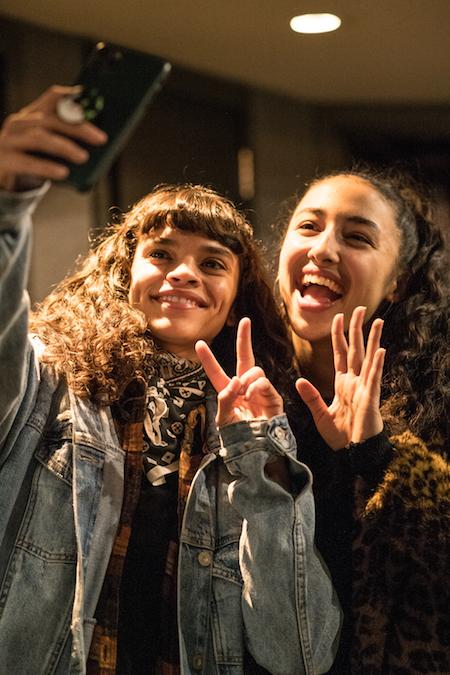 Two young women pose for a photo.