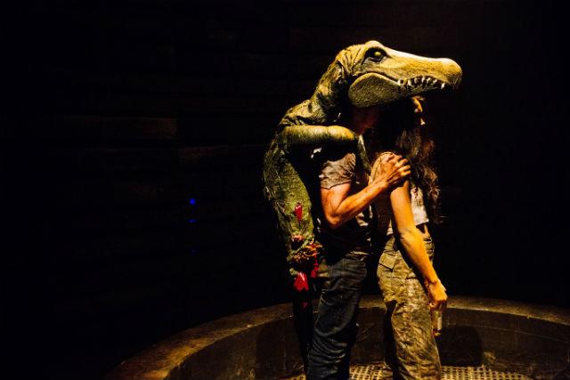 A scene from Alligator by Hilary Bettis A man in an alligator suit hugs a woman