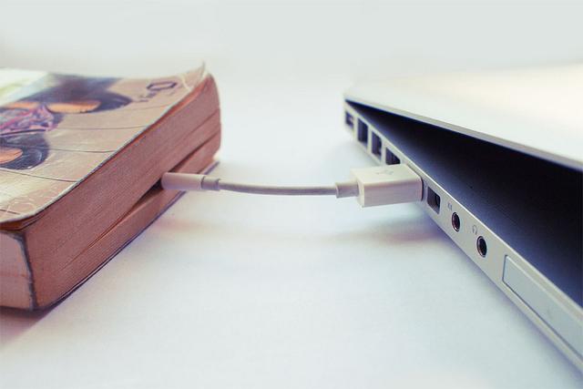 Book connected to computer by wire