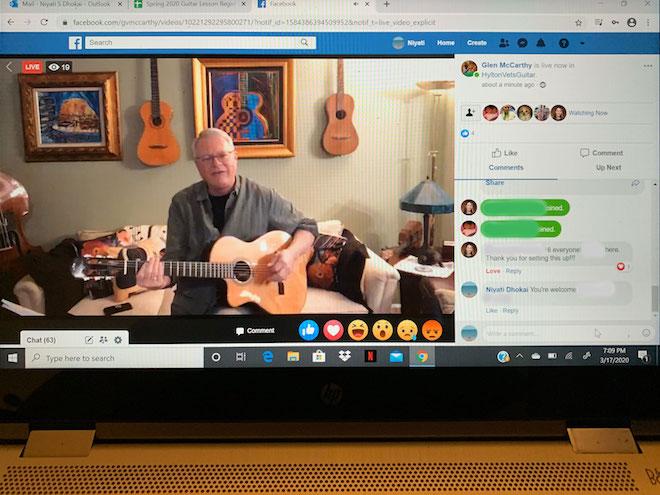 screen shot of an older man holding a ukulele