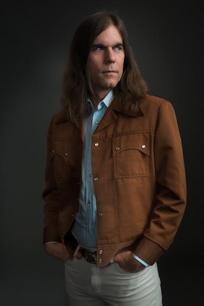a medium shot of composer Graham Reynolds