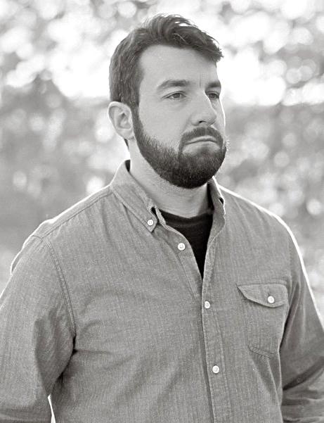 Black and white photo of man with beard and moustache