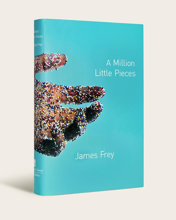 Cover of A Million Little Pieces by James Frey Blue book cover with extended hand covered in rainbow sprinkles