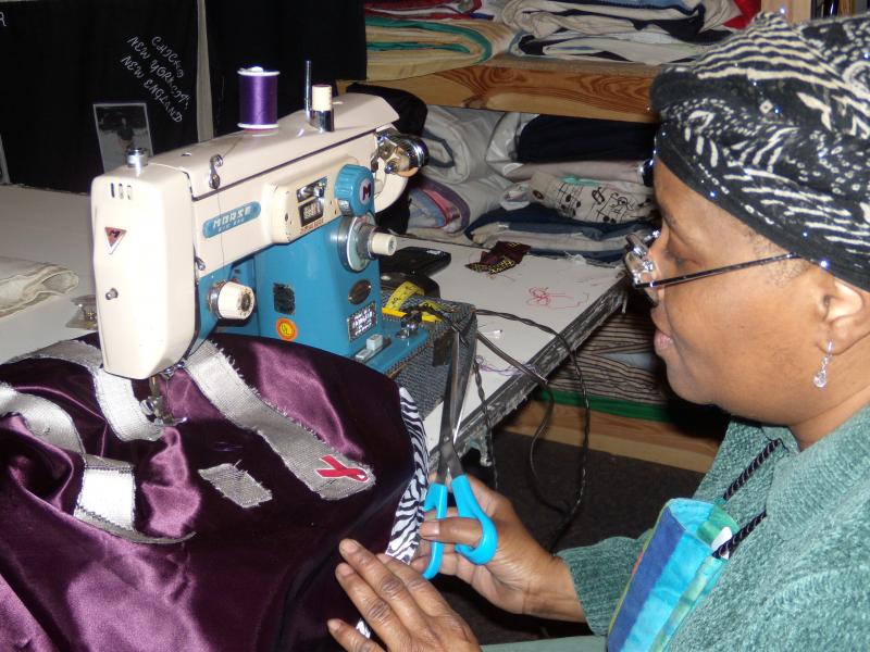 Woman sewing a quilt. 