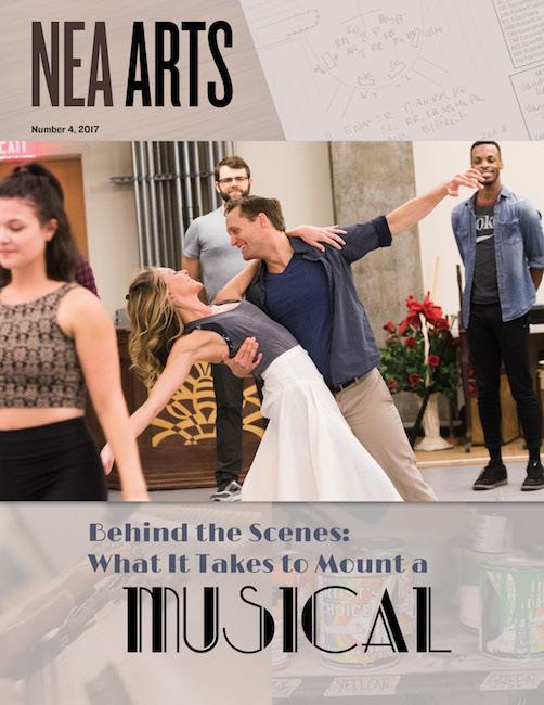 cover of 2017 Vol 4 issue of NEA Arts with center photo of couple rehearsing a dance move and text that says Behind the Scenes What It Takes to Mount a Musical