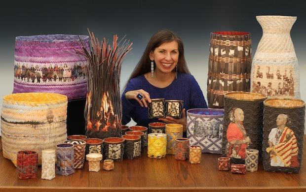 a native american woman with long dark hair surrounded by a selection of handwoven baskets featuring photographs and snippets of texts