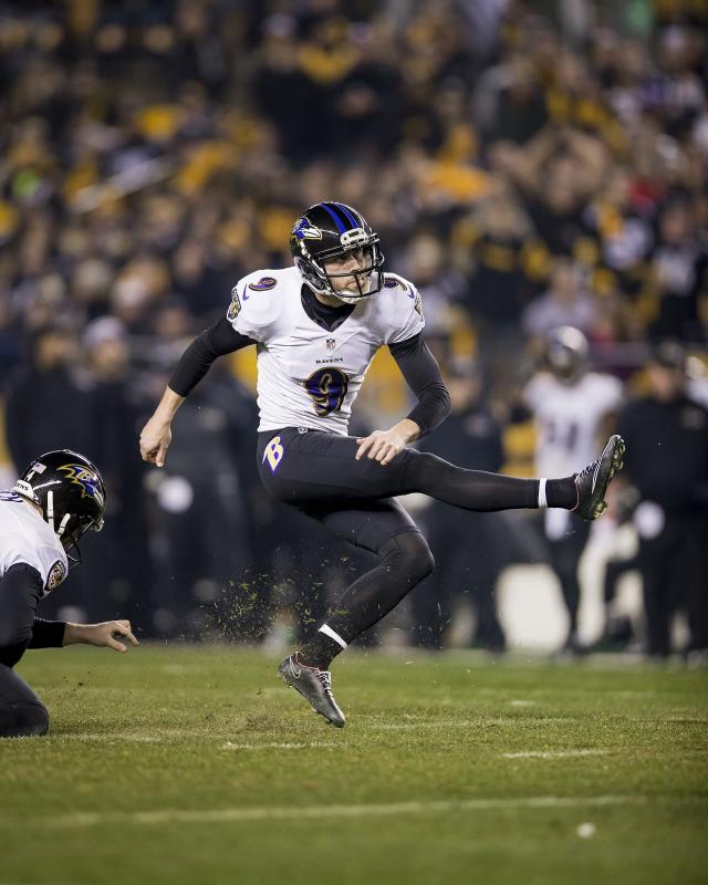 Football player kicking a ball.
