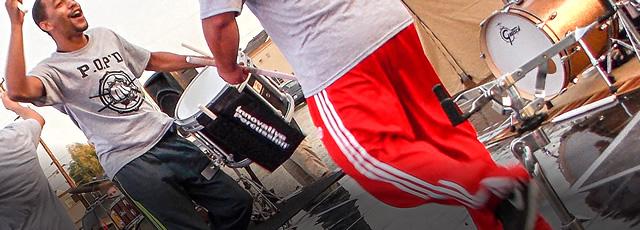 Close up of standing drummers in action