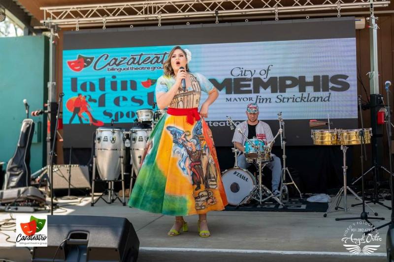 a woman singing on a stage