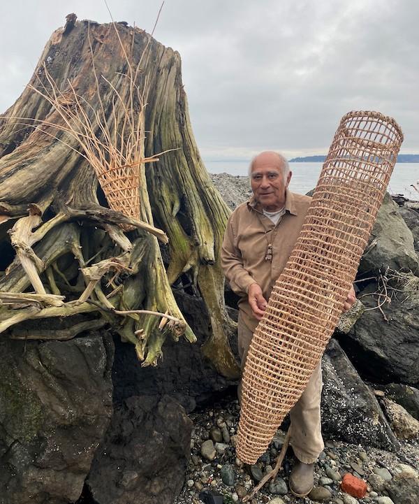 Man holding a large basket.