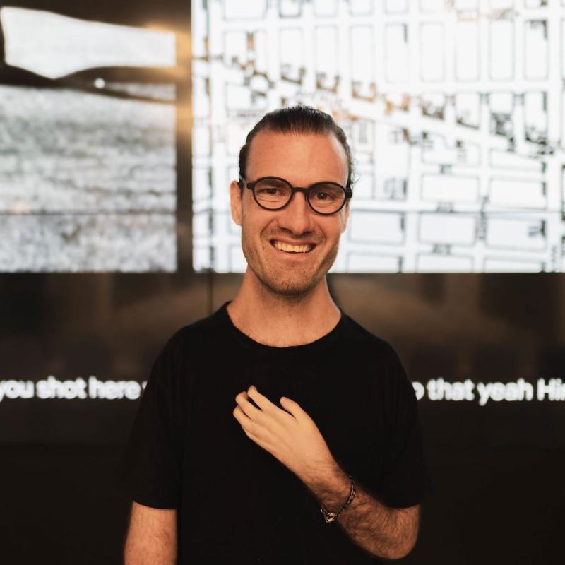 photography of Joshua Halstead who is a White man. He is wearing glasses and has close cropped hair