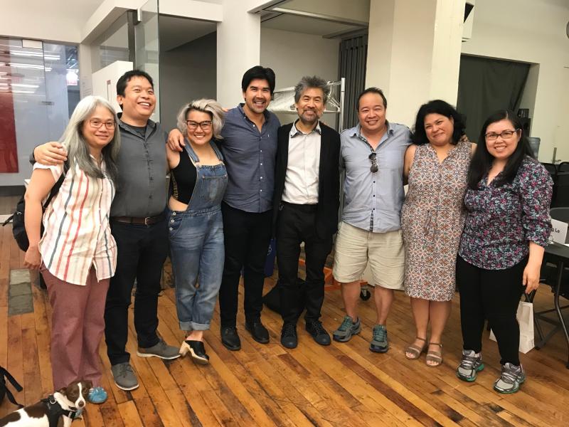 Group of Asian people standing together in a pose.