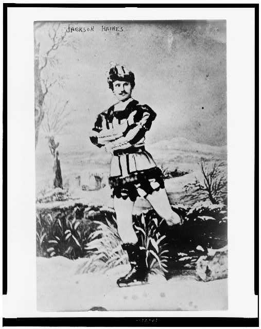 Black and white photograph from the late 1800s of Jackson Haines with one foot on the ice and the other lifted slightly.