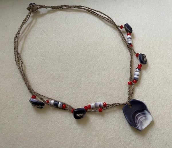 A neclase with  a conch pending.